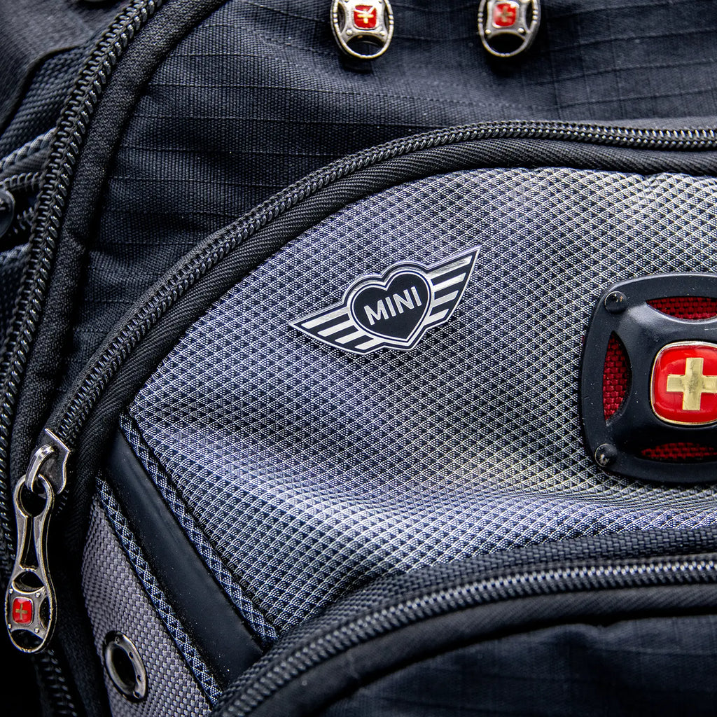 Close-up of a backpack with a MINI Heart pin.