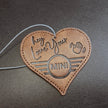 Leather MINI Love Ducking Ornament with ‘Hey, Love Your MINI’ debossed design.