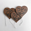Three Leather MINI Love Ducking Ornaments with ‘Hey, Love Your MINI’ debossed design on a light gray background.